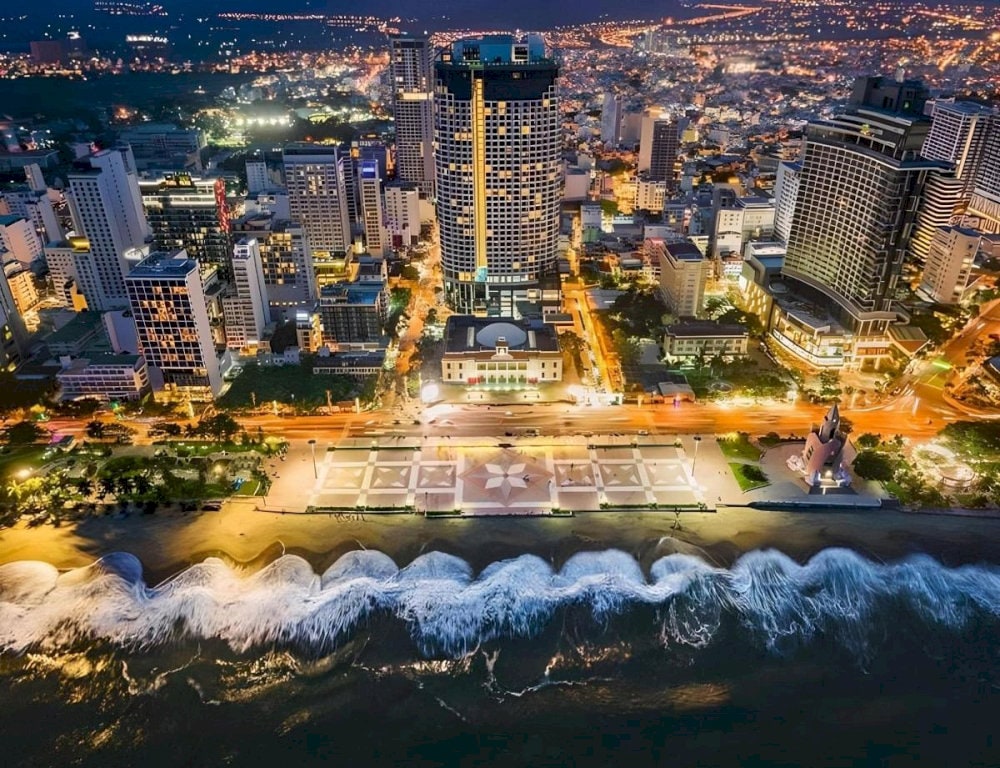 The artistic lighting system transforms the tower into a vibrant centerpiece, enhancing the city's coastal charm